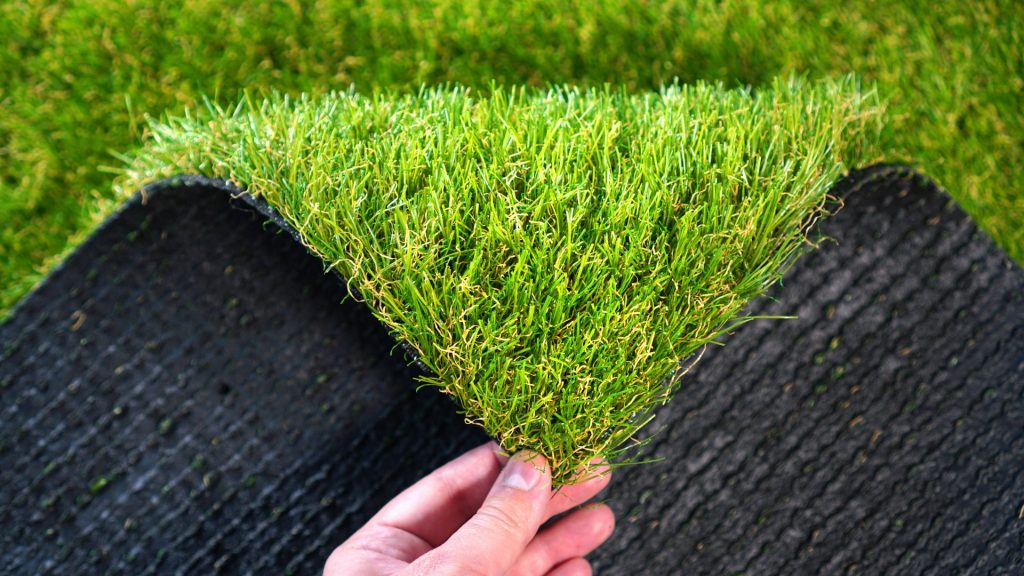 Holding the corner of artificial grass