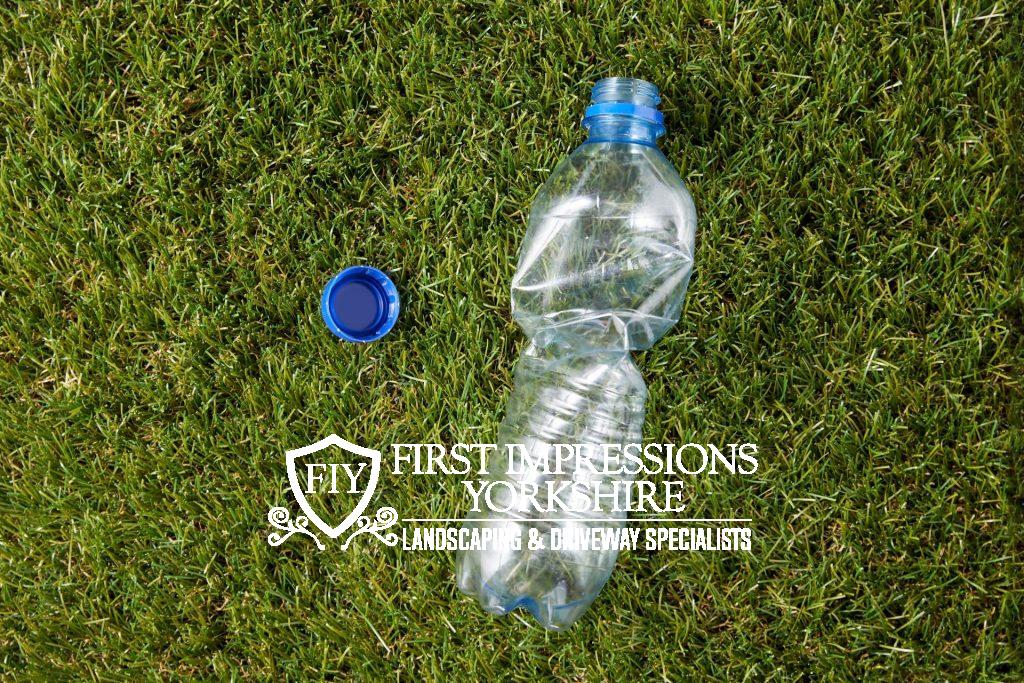Water bottle scrunched up on artificial grass