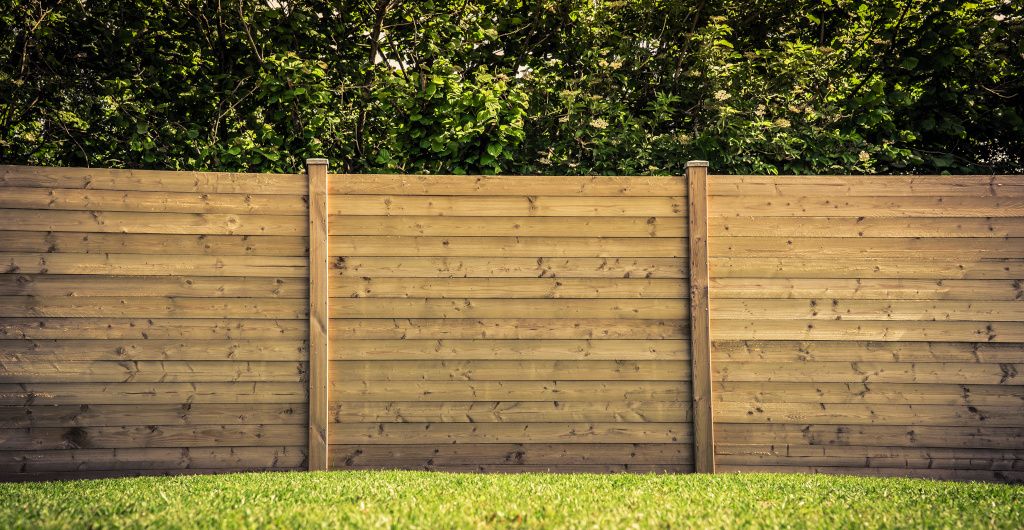 Wooden fencing surrounding property