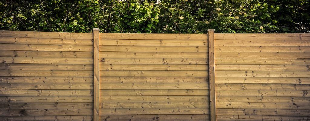 Wooden fencing surrounding property